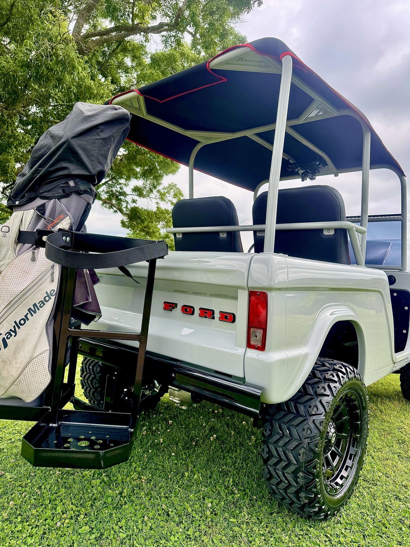 Custom golf bag rack and lifted rear stance
