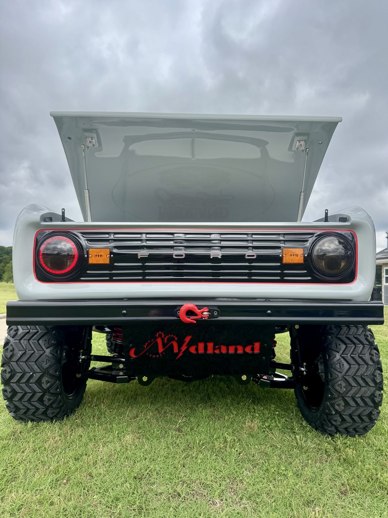 Custom fabricated front end with halo lights and Midland branded bumper