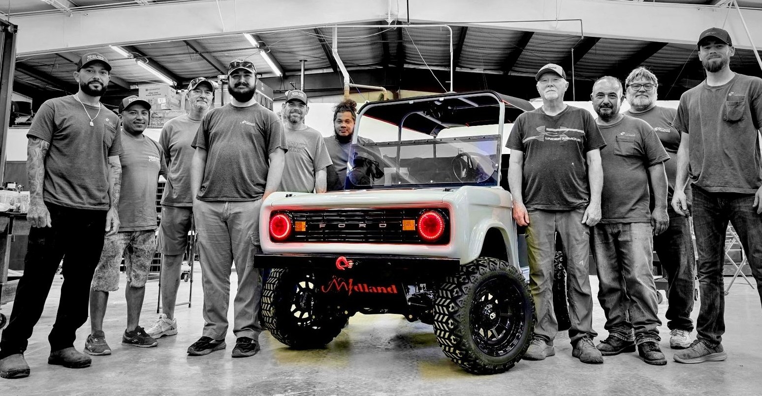 The Midland Custom Shop team with a finished build on the shop floor