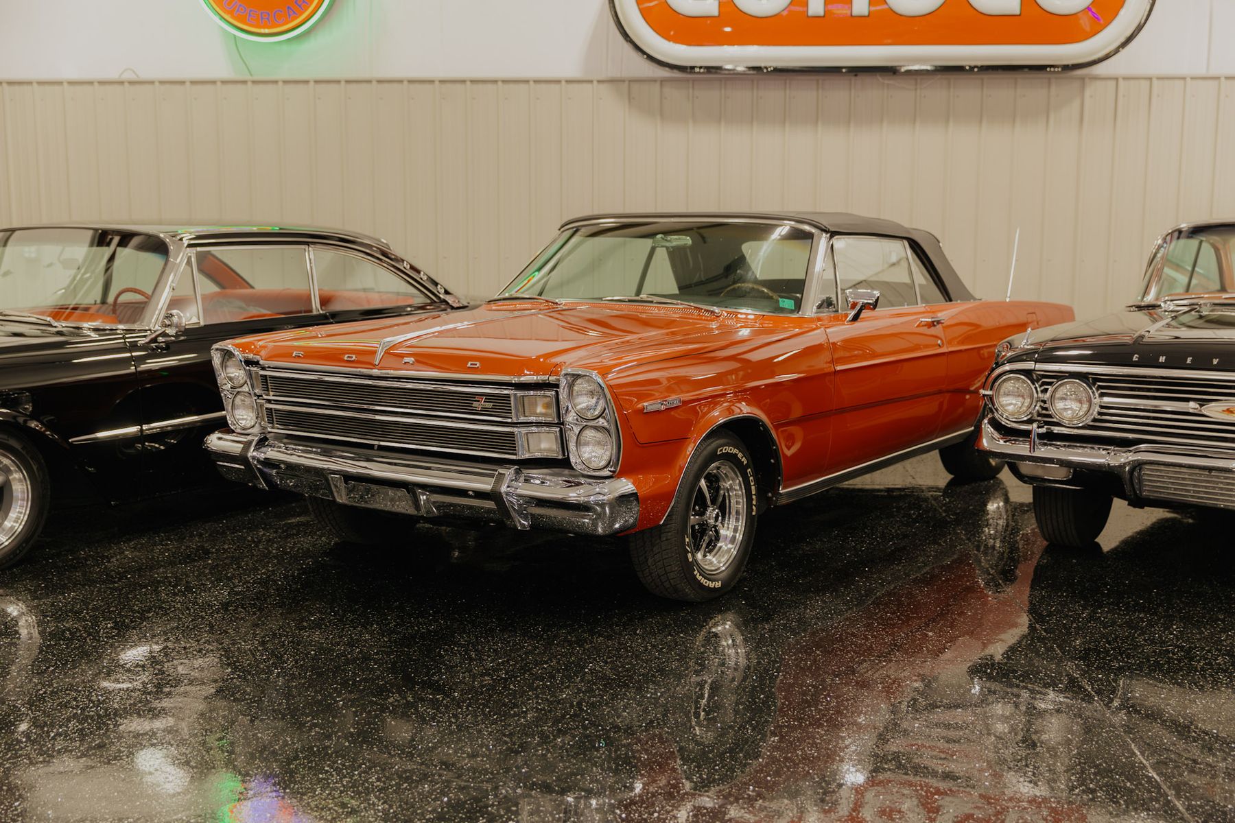 Orange Ford Galaxie convertible with black top