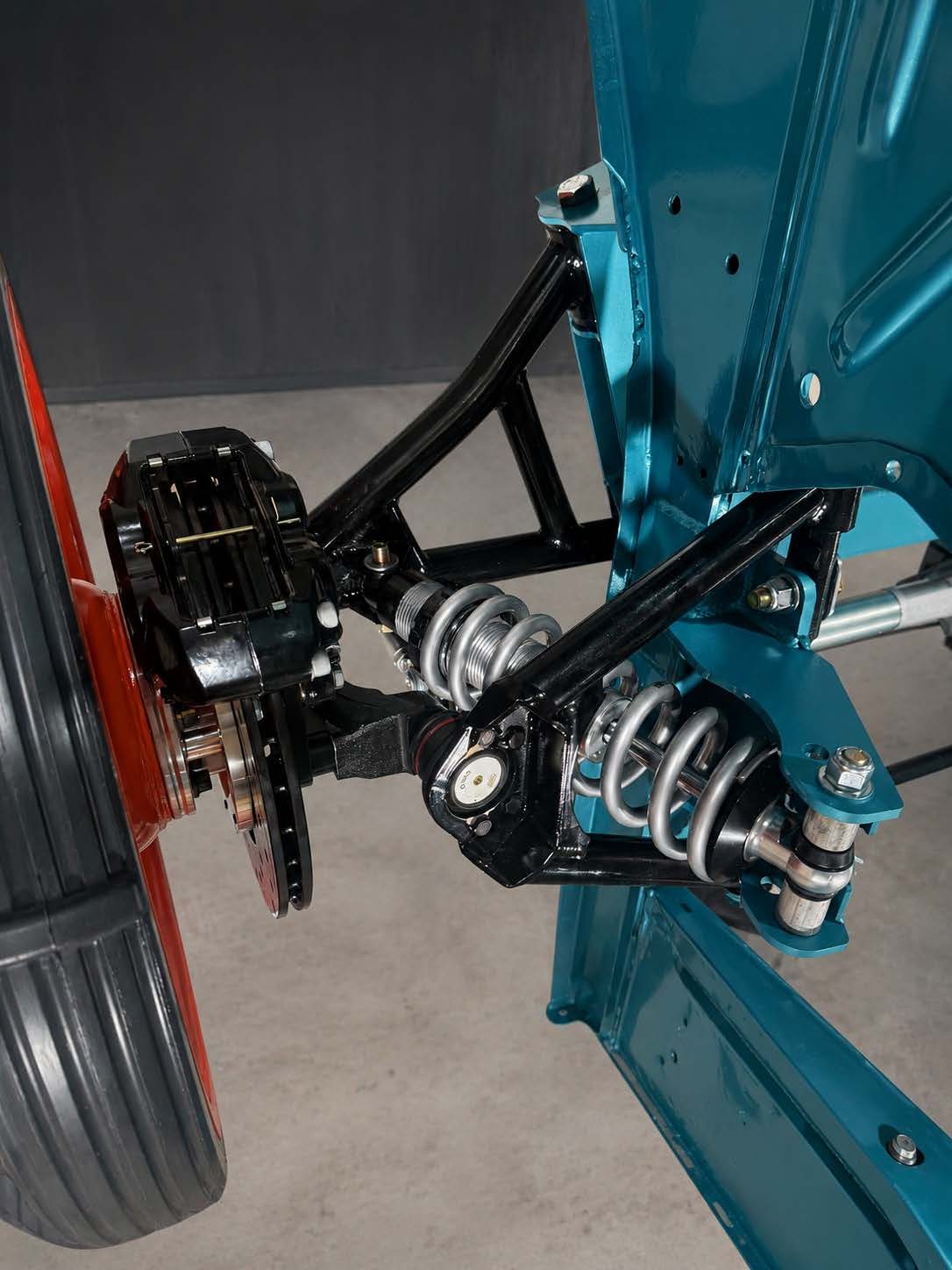 Coilover and brake detail against painted body
