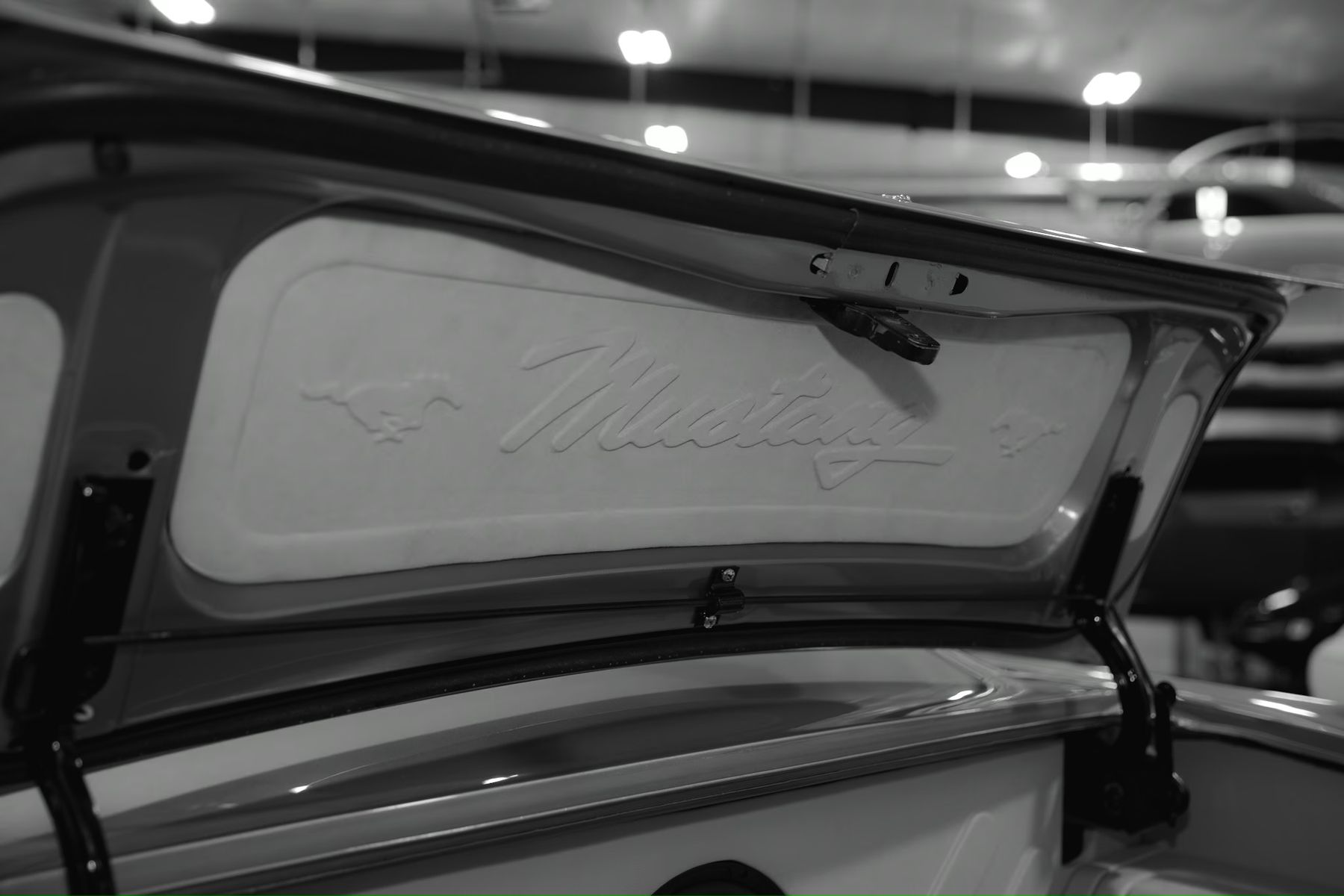 Embossed Mustang script inside a classic trunk lid